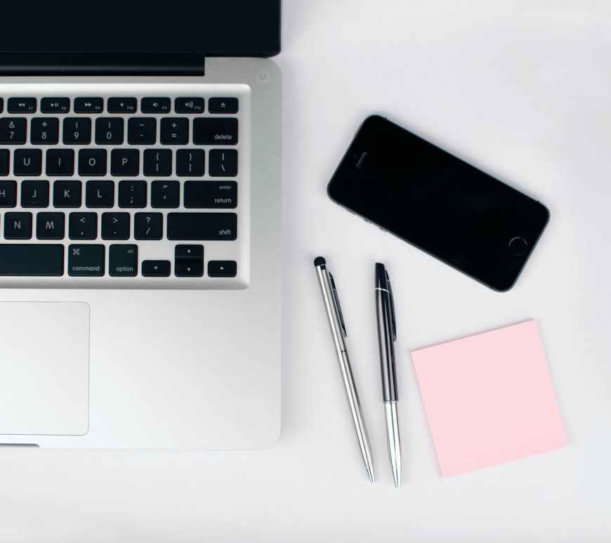 two pens beside macbook